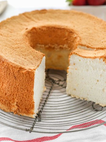 An angel food cake sitting on top of a wire rack.