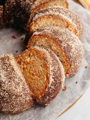 An overhead view of a sliced apple cider donut cake.