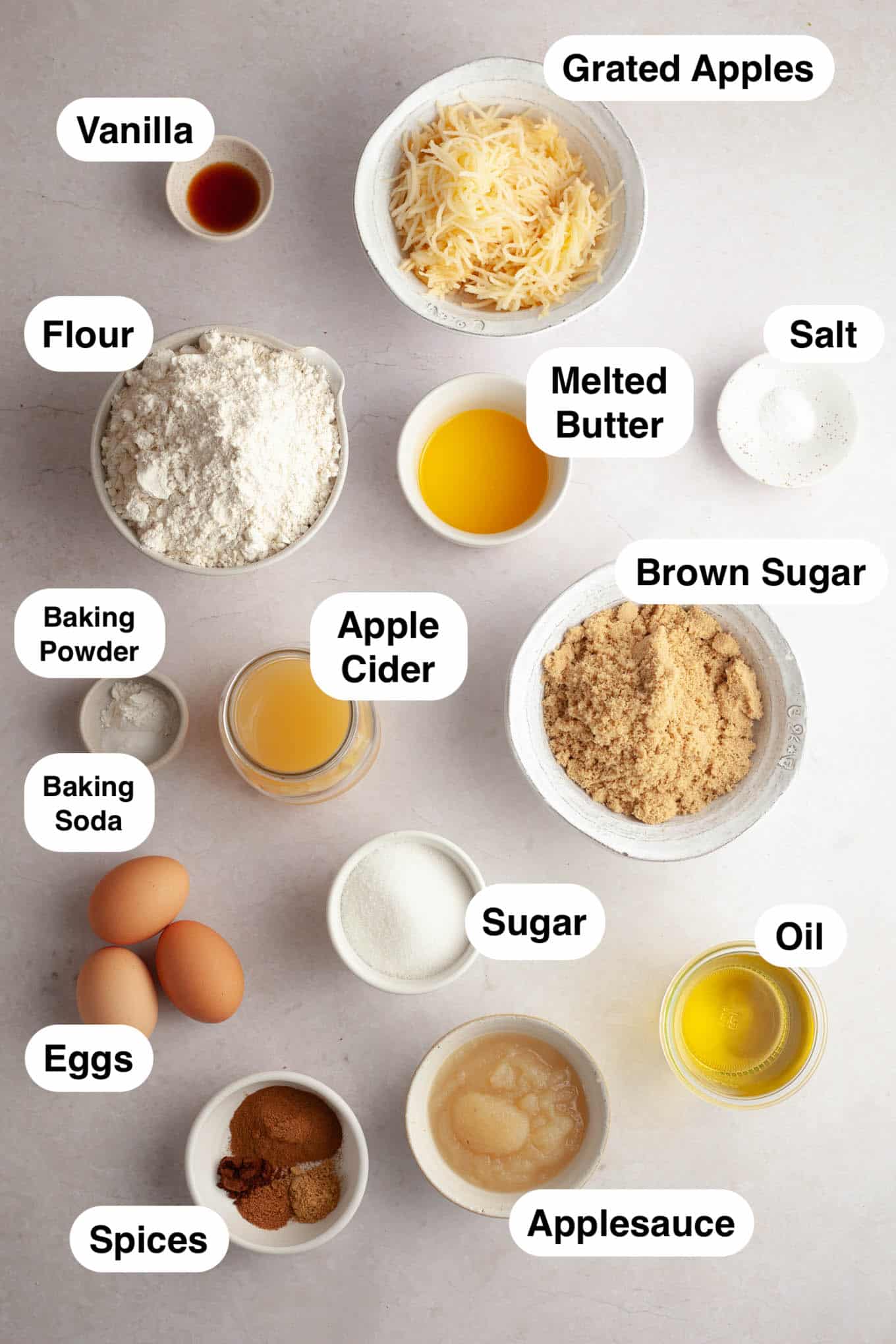 An overhead view of the ingredients needed to make an apple cider donut cake. 