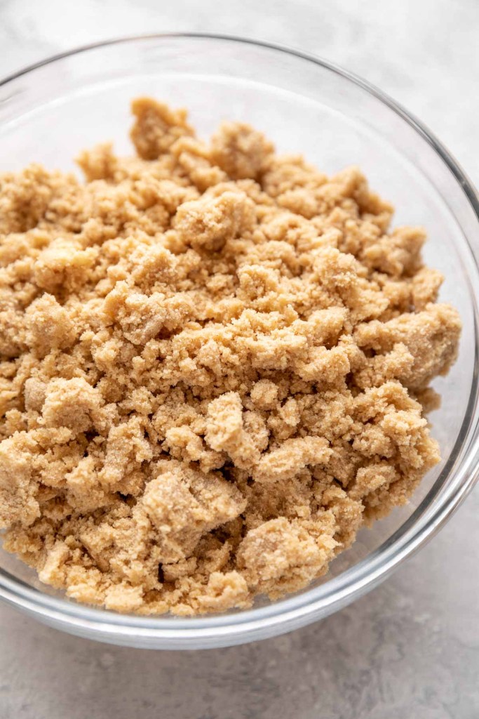 A bowl filled with crumb topping.