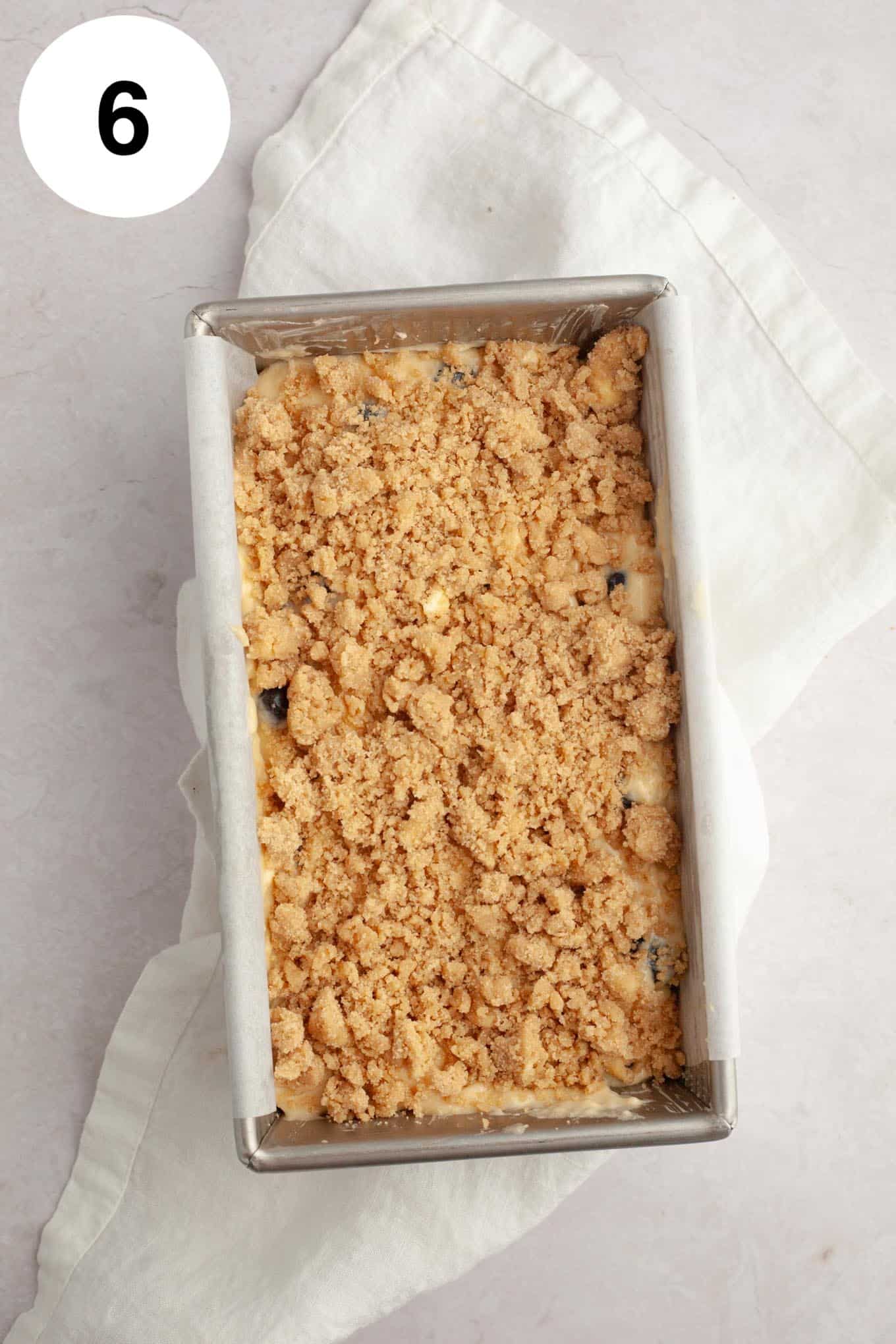 An overhead view of an unbaked blueberry loaf. 