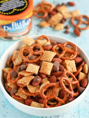 An easy to make snack mix filled with honey, pretzels, chocolate, almonds, and more! This Honey Almond Snack Mix makes a perfect snack for any party or occasion!