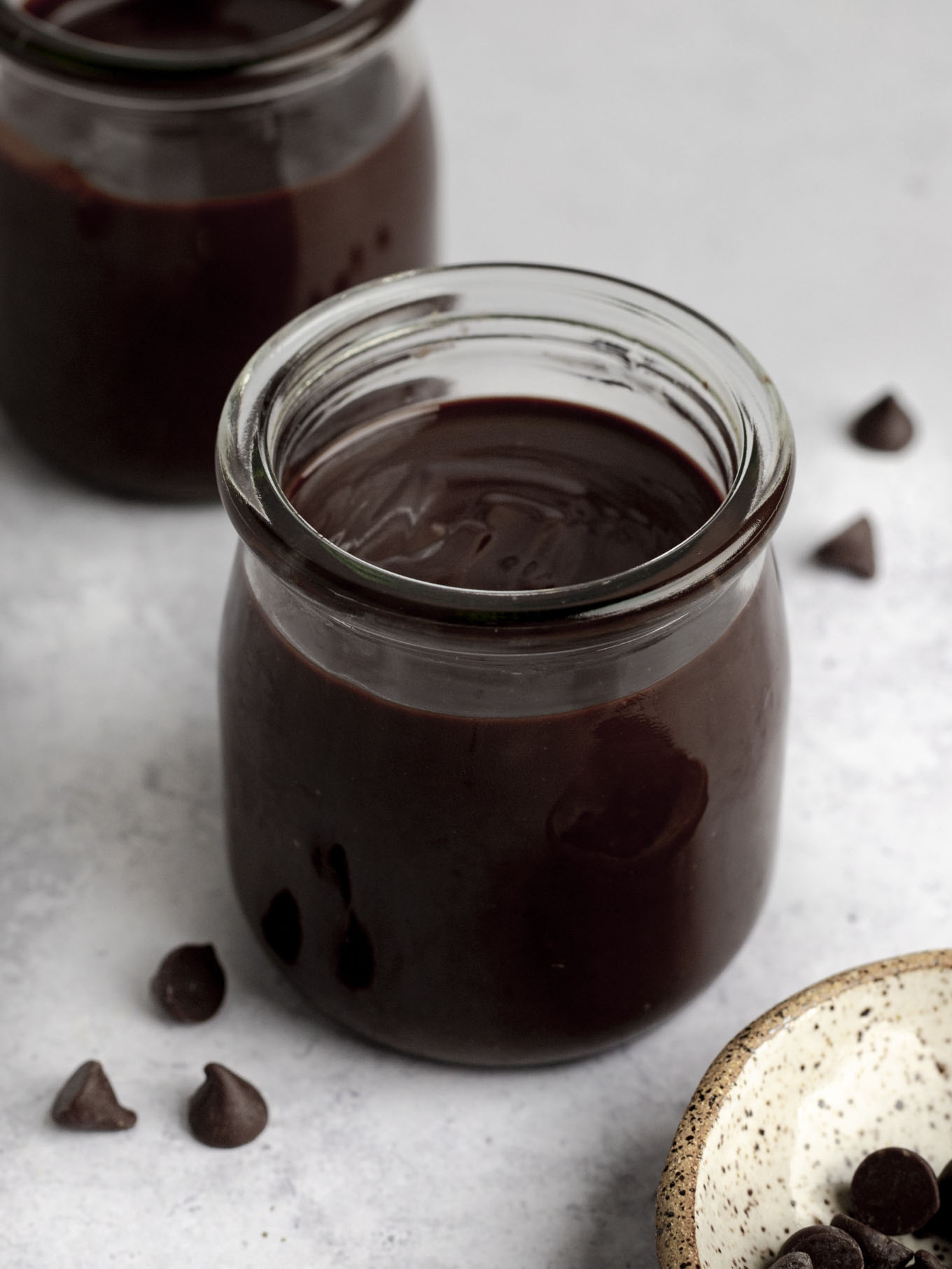 A glass jar of homemade hot fudge. 