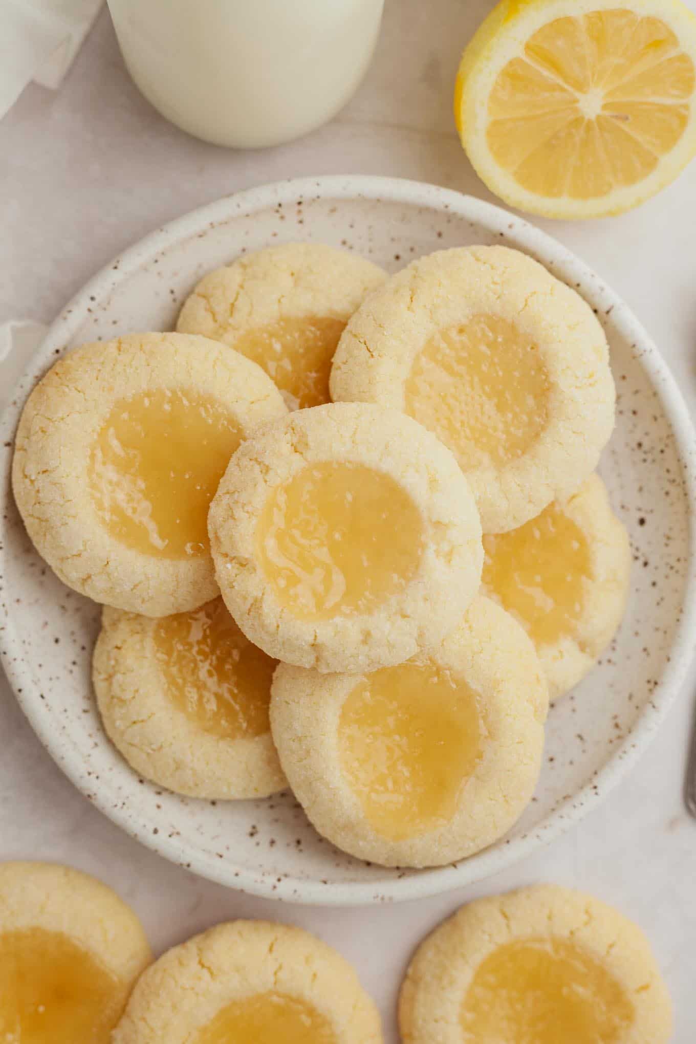 An overhead view of a plate of lemon curd cookies. 