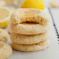A stack of four lemon curd cookies.