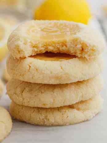A stack of four lemon curd cookies.