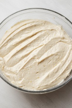 Lemon pound cake batter in a glass mixing bowl.