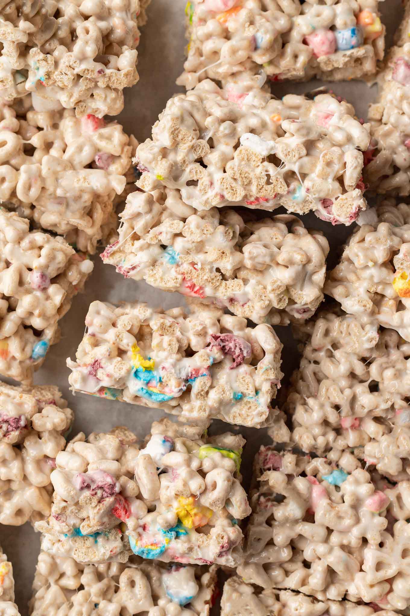 An overhead view of sliced Lucky Charms bars, turned up on their sides.
