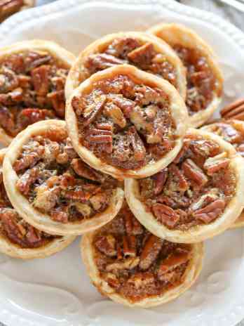 These Mini Pecan Pies are easy to make and can also be made ahead of time. These are the perfect mini treat for Thanksgiving too!