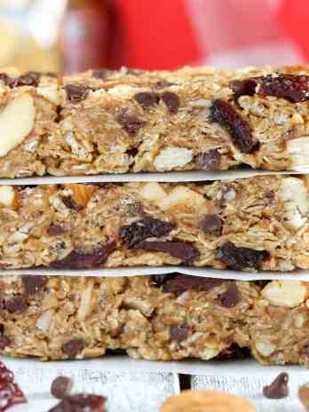 A stack of three chocolate chip almond butter granola bars.