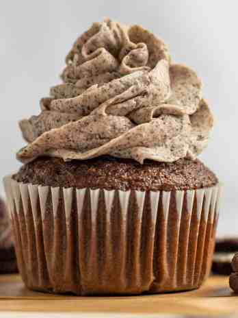 A chocolate cupcake topped with Oreo frosting.