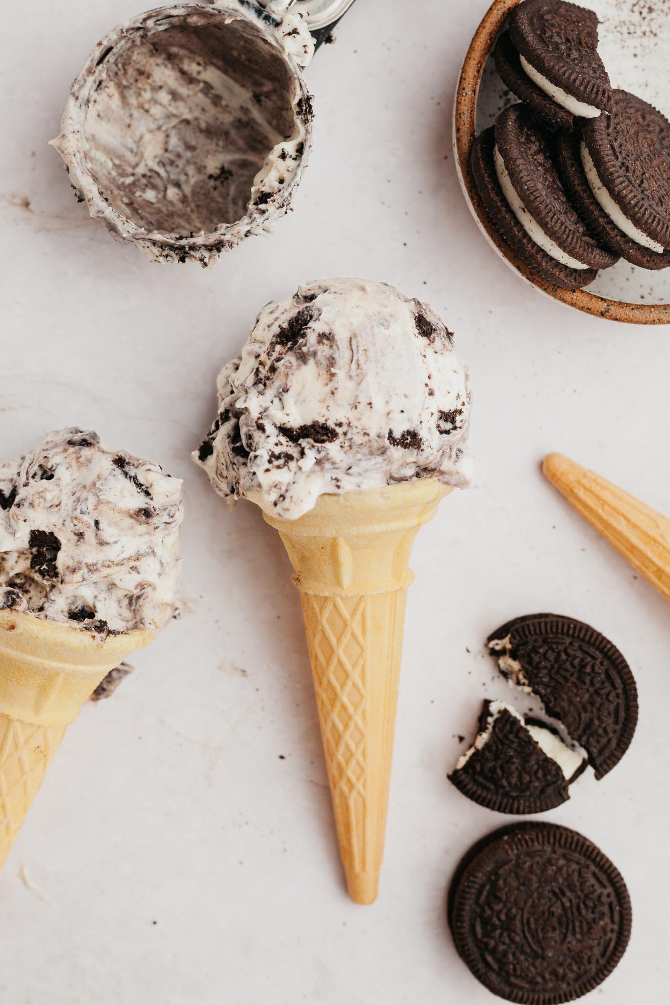 An overhead view of an Oreo ice cream come lying on its side on the countertop.