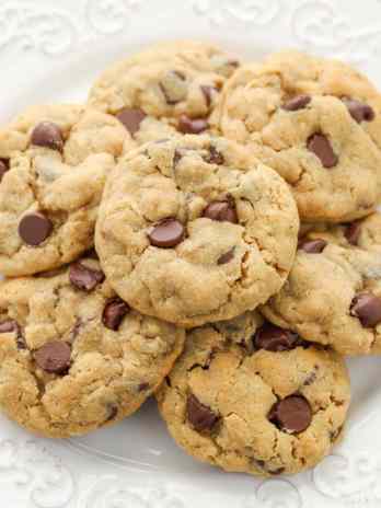 A stack of peanut butter oatmeal chocolate chip cookies on a plate.