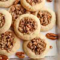 Several pecan pie cookies stacked on top of each other.