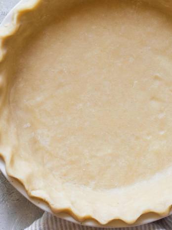 A finished pie crust ready to make a pie.