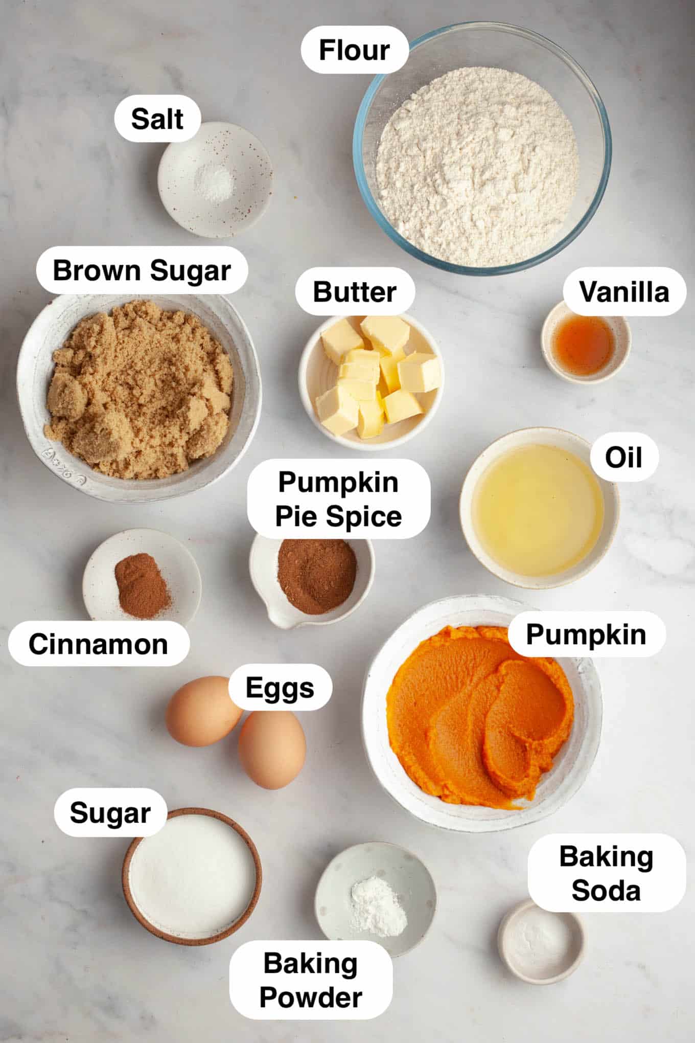 An overhead view of the ingredients needed to make pumpkin coffee cake with streusel topping. 