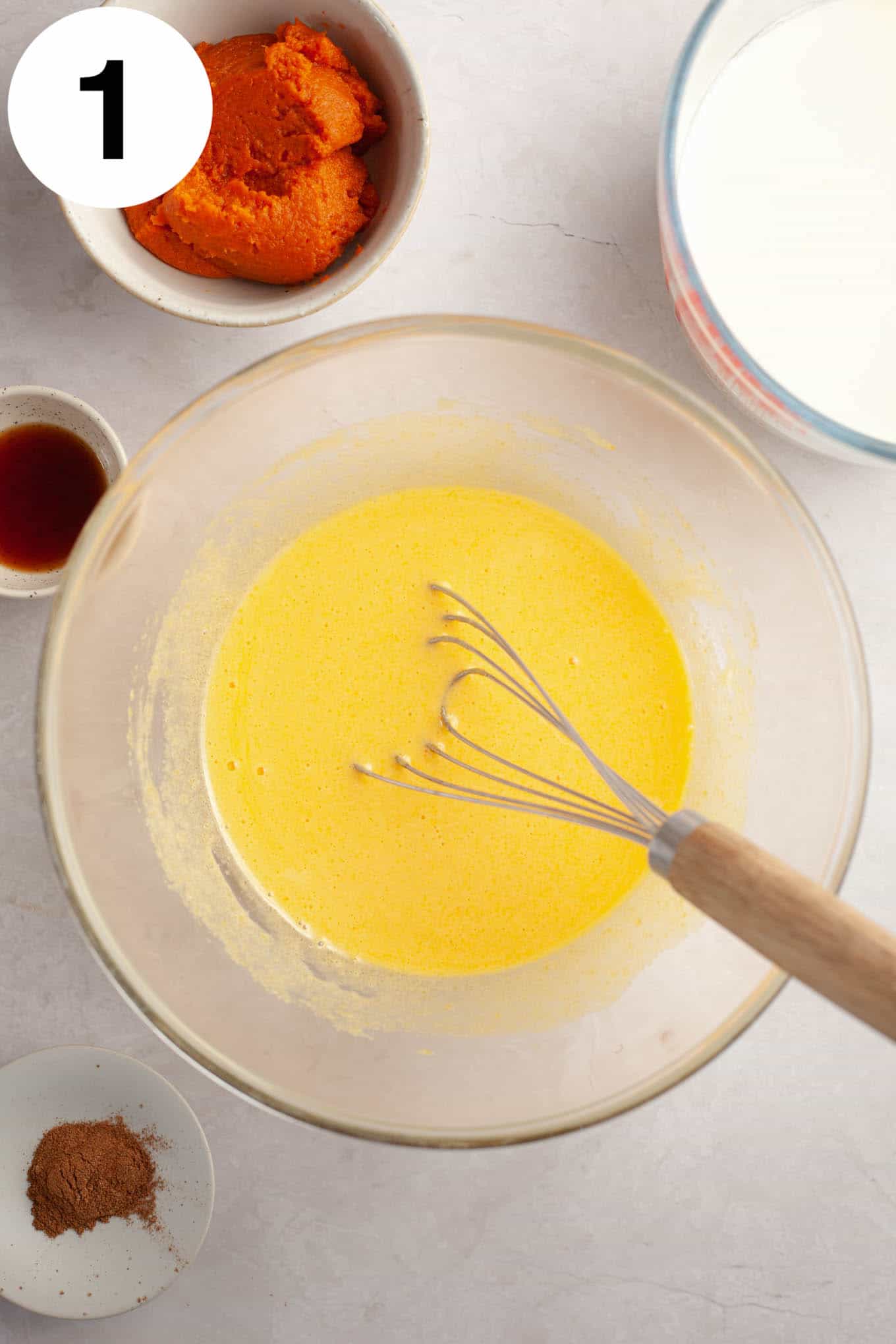 An overhead view of an egg yolks and sugar mixture. 