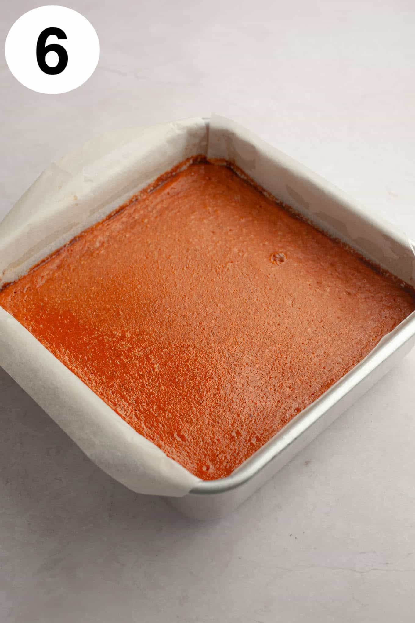 A pan of unsliced pumpkin pie bars. 