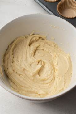 Vanilla cupcake batter in a mixing bowl.