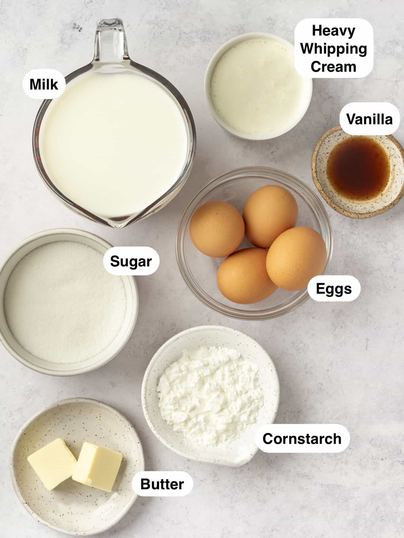 An overhead view of the ingredients for homemade vanilla pudding. 